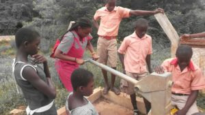 Pumping Water at the Recently Repaired Clean Water Well!