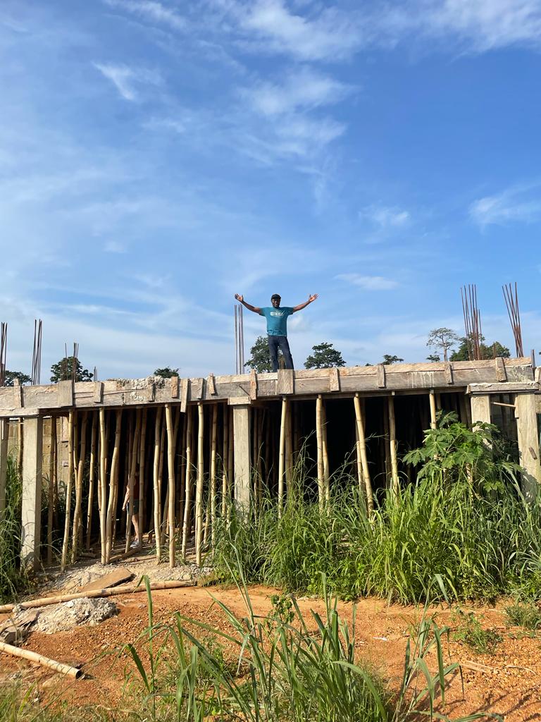 The Leadership Center building is under construction during this Ghana Mission.  It will be used for teacher trainings, housing missionaries and volunteers, and educational and community affairs.  Here, our founder stands on top of the roof, celebrating the progress.